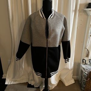 Gray and Black sweat jacket with black and white stripe on collar and sl…